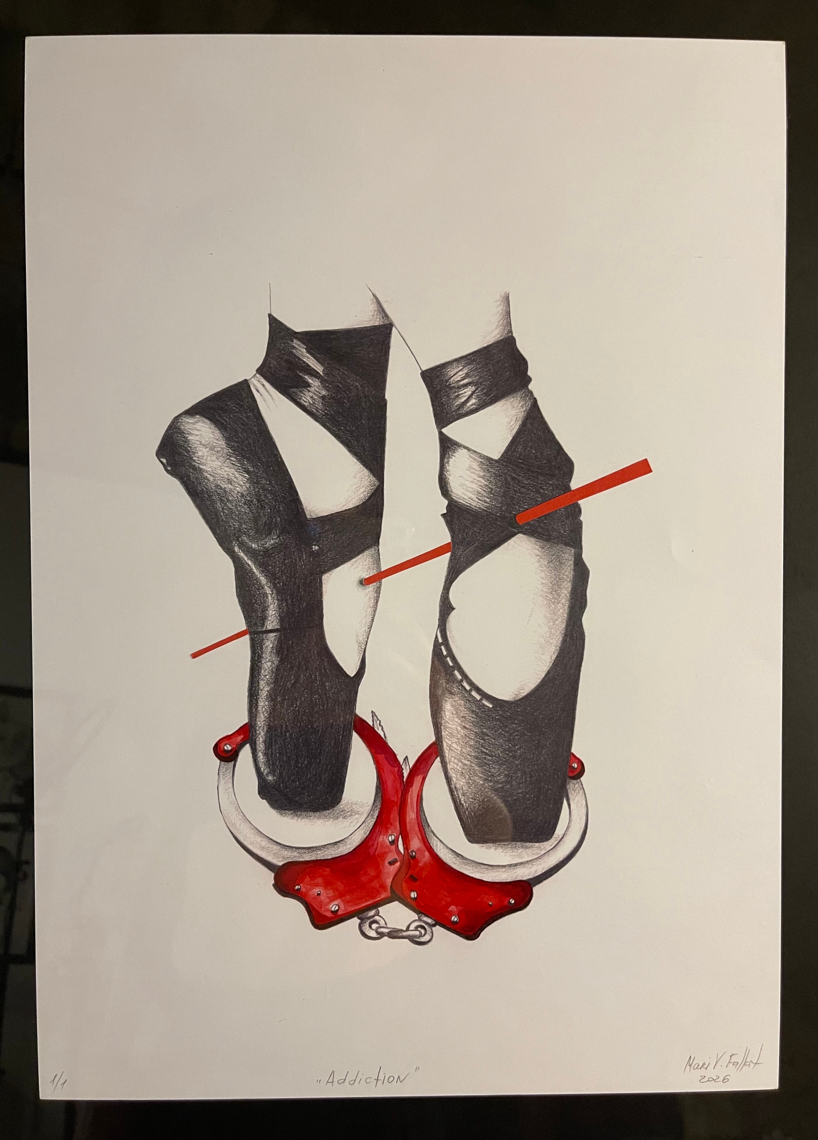 Two black and white high-heeled shoes with red accents, positioned on a white background, with a red line crossing both shoes.