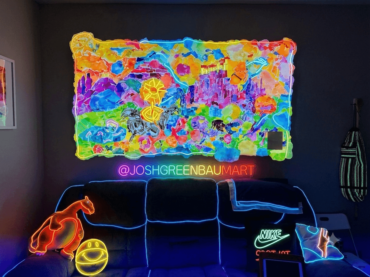 Colorful neon art display with a bright, abstract background, neon text, and glowing objects on a dark wall.