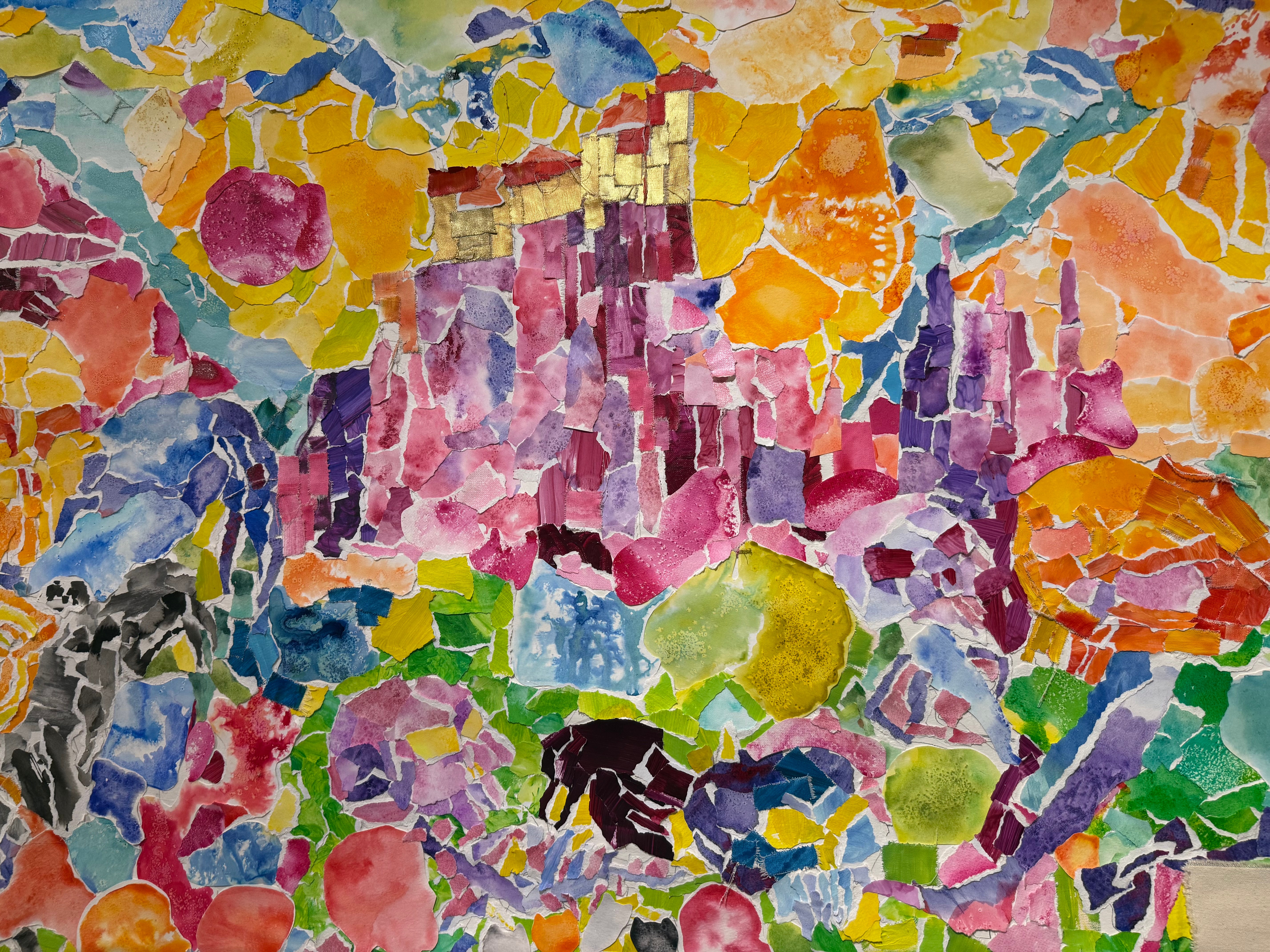 Colorful abstract painting with various shapes and vibrant colors, resembling a cityscape or landscape, with a mix of pink, yellow, purple, and green hues.