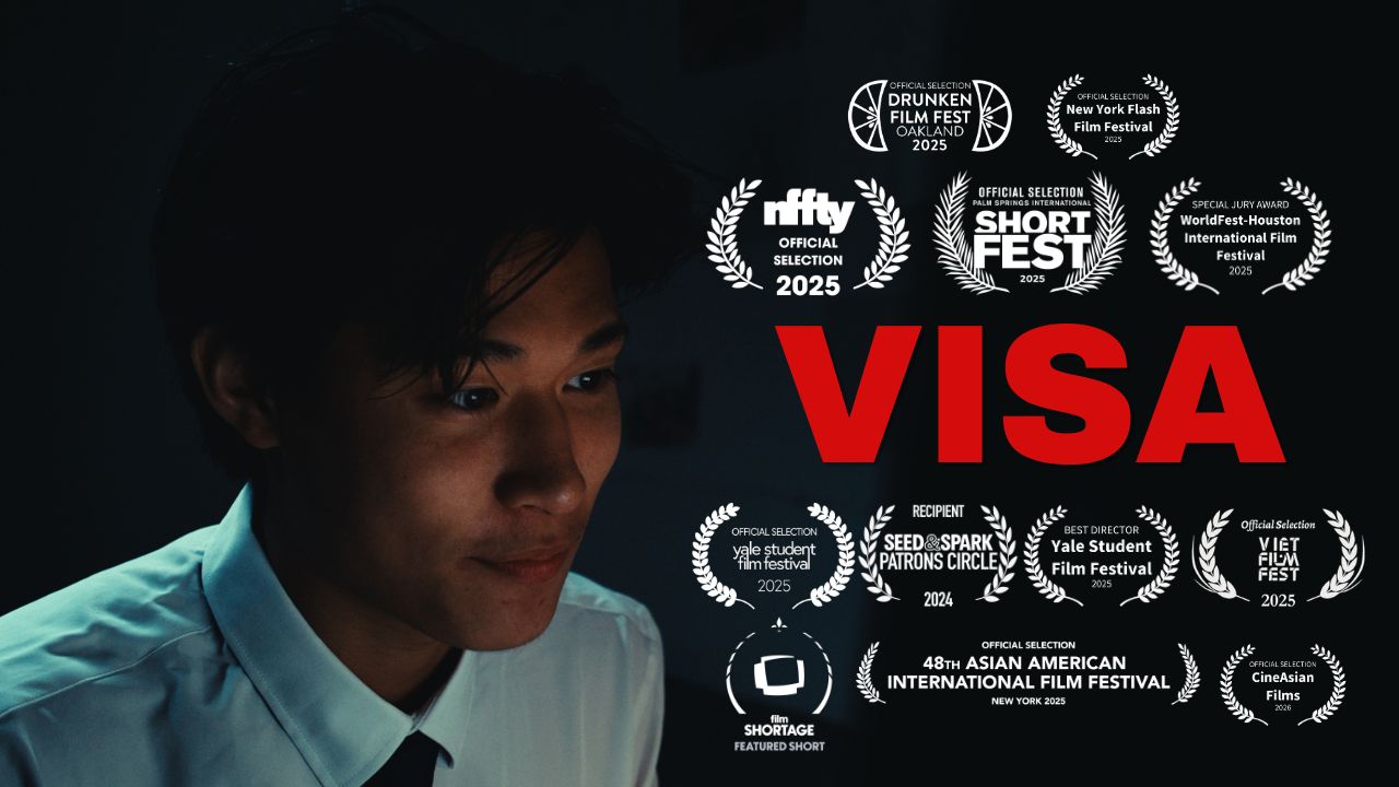 Young person with dark hair and a white shirt, awards and festival logos in the background, and the word 'VISA' in red.